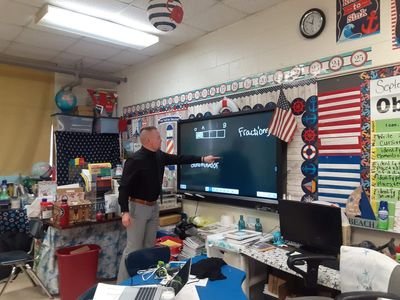 Dr. Sam Strother teaching fractions at the board
