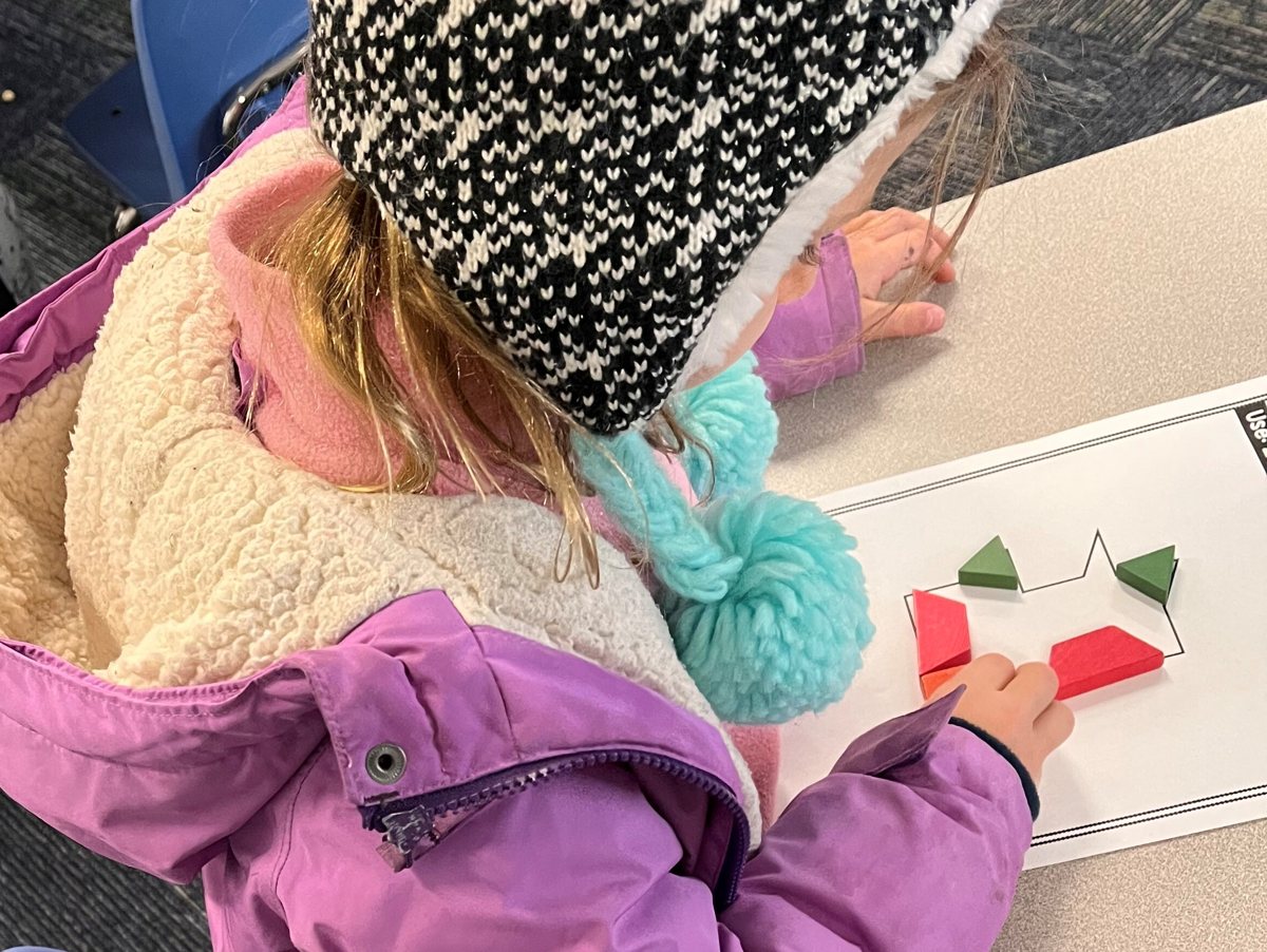 Kindergarteners building number patterns with pattern blocks