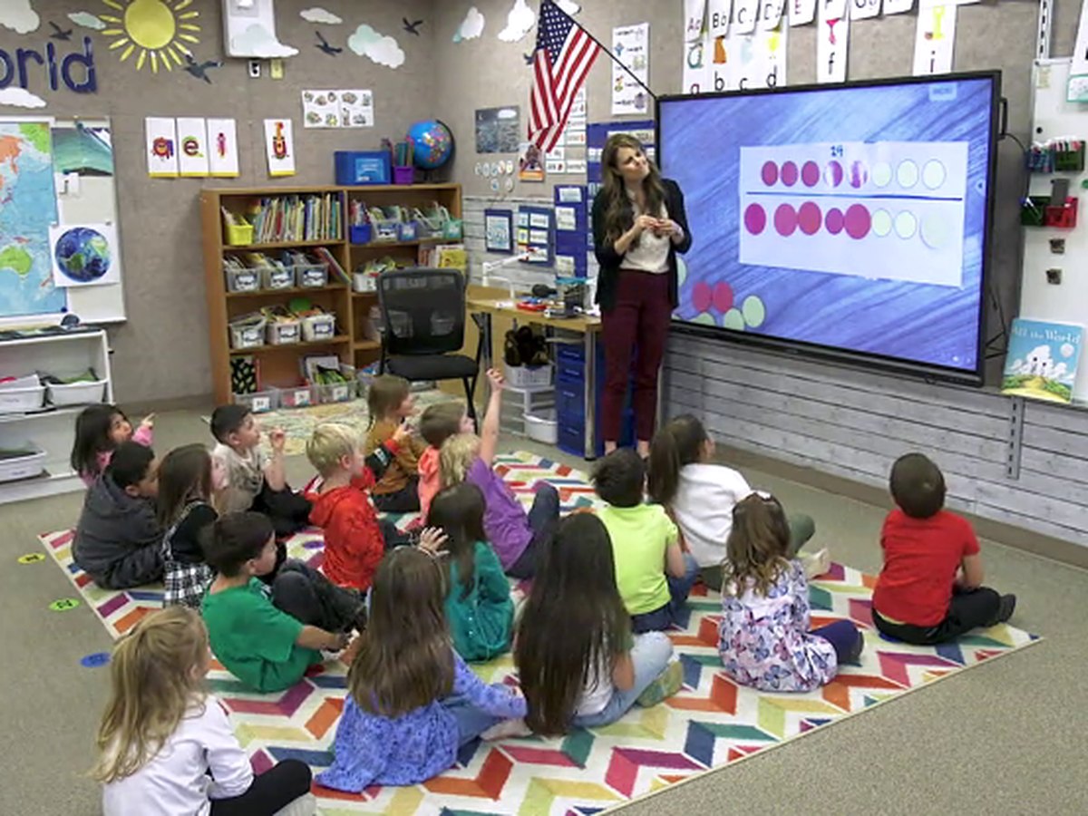 Mrs. Stucki teaching a kindergarten math lesson at the carpet